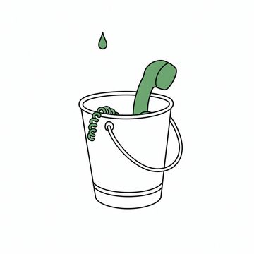 Line illustration: a galvanised bucket standing on the floor with a desk telephone's handset lying inside it and the coiled cord looping out over the rim, one water drop hanging in the air above, the handset the accent colour