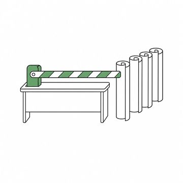 Line illustration: a striped level-crossing boom barrier lowered across the middle of a desk with a short queue of rolled-up blank posters standing behind it waiting their turn, no lettering, numbers or markings on the posters or the barrier, the boom barrier the accent colour