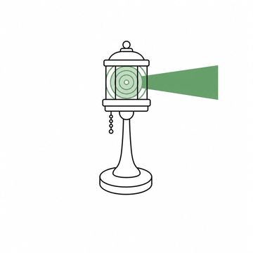 Line illustration: a small waiting-room table lamp whose shade has been replaced by a rotating lighthouse lens casting one narrow beam, the lens and its beam the accent colour